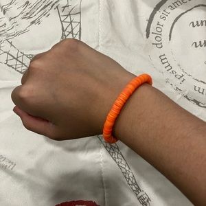 I’m selling a plain orange cley bracelet